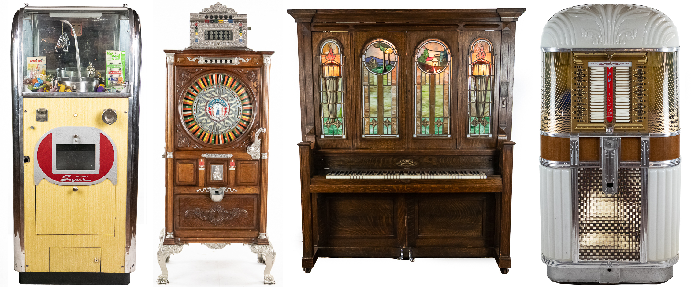 Four mechanical wonders in a row from the CAF collection: a Champion vending machine, an ornate slot machine, a stained-glass automatic piano, and a chrome AMI jukebox.