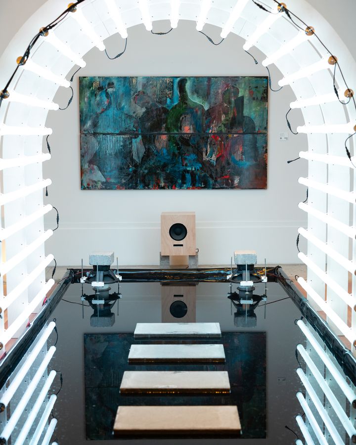 An arch of light framing a painting at the end of a gallery. July 7, 2026.